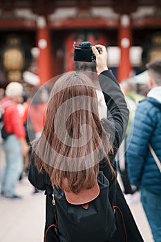 Tourist woman visit Sensoji Temple or Asakusa Kannon Temple is a Buddhist temple located in Asakusa. Landmark and popular for