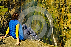 Tourist woman at Voringsfossen waterfall Norway