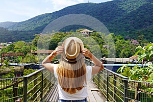 Tourist woman walking on metallic walkway in Paranapiacaba, Rio Grande da Serra, Brazil