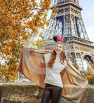 Tourist woman wearing Minnie Mouse Ears having fun time in Paris