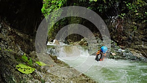 Tourist Women Is Sent By Zip Line Over The Waterfall While Canyoning