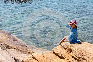 Tourist young girl on Aegean coast of Sithonia peninsula