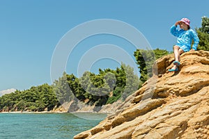 Tourist young girl on Aegean coast of Sithonia peninsula