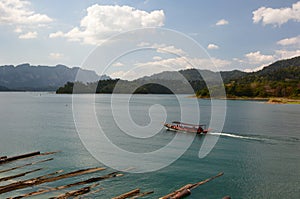 A touristic boat on Cheow Lan lake. Khao Sok National Park. Surat Thani province. Thailand