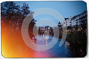 touristic boat at dusk on the Ill river in Strasbourg