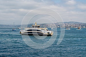 Touristic boats in Golden Horn bay of Istanbul and view on Suleymaniye mosque, Turkey