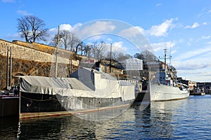 Touristic scenic view of the Oslo harbour near the Akershus Fortressand the city in the dusk , Norway, Europe