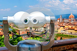 Touristic telescope with an aerial view of Cathedral Santa Maria del Fiore, Florence, Italy