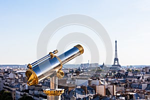 Touristic telescope overlooking Eiffel Tower from the roof of Pr