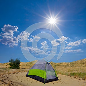 touristic tent stay on sand under a sparkle sun