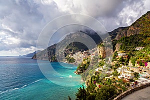 Touristic Town, Positano, on Rocky Cliffs and Mountain Landscape by the Sea. Amalfi Coast, Italy photo