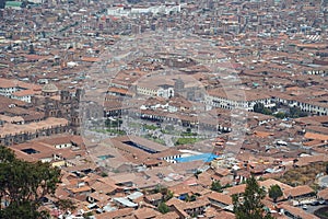 Touristic view of Cusco Peru main city square with red tile roofs