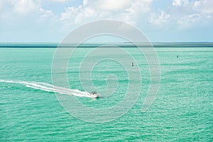 Touristic yacht floating on turquoise water at Key West, Florida