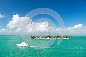 Touristic yachts floating by green island at Key West, Florida