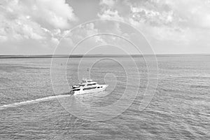 Touristic yachts floating by green island at Key West, Florida