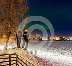 Tourists admiring the Northen Lights in Lapland, Finland