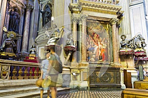 Tourists admiring the paintings from Cathedral Santa Maria Assunta