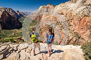 Tourists with backpack hiking in Zion