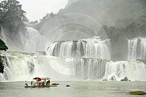 Tourists at Bamboo Raft close to Ban Gioc Waterfall, Vietnam