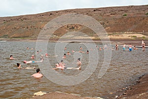Tourists bathing in the salt crater lake. Pedra de Lume. Sal island. Cape Verde