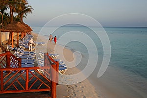 Tourists on the Beach at Dawn