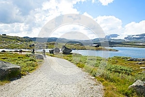Tourists biking and beautiful landscape in Finse, Norway