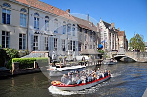 Tourists boat trip on the Dijver Canal, Bruges