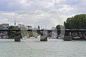 Tourists on the bridge its Pont des Arts in Paris