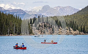 Tourists canoeing on Moraine Lake in Banff National Park, Alberta, Canada