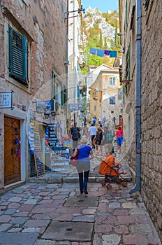 Tourists climb narrow street of Old City to fortress, Kotor, Montenegro