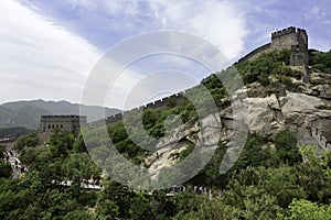 Tourists climb stairs to reach the Great Wall of China in Badaling