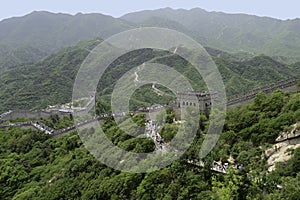 Tourists climb stairs to reach the Great Wall of China in Badaling