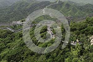 Tourists climb stairs to reach the Great Wall of China in Badaling