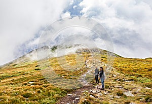 Tourists climb to the top