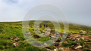 Tourists climb to the top of Hoverla in Carpathians, Ukraine