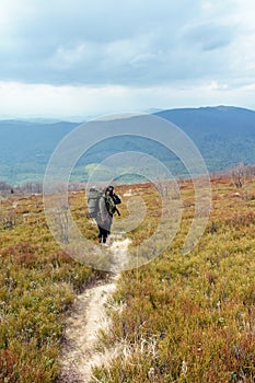 Tourists climb to the top of Runa mountain in Carpathians