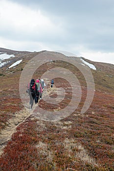 Tourists climb to the top of Runa mountain in Carpathians