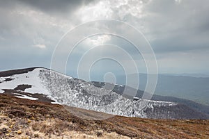 Tourists climb to the top of Runa mountain in Carpathians