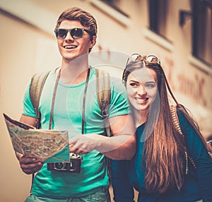 Tourists couple with map in old city