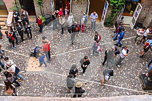 Tourists in the courtyard of Juliet's house. Verona, Italy