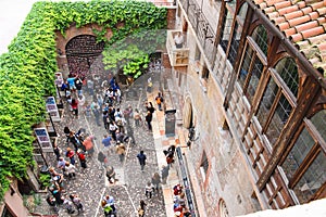 Tourists in the courtyard of Juliet's house. Verona, Italy