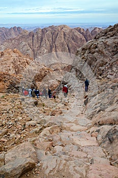 Tourists descend on the long trail from the top of Mount Moses,