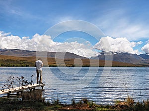 Tourists embrace the peaceful beauty of Lake Alexandrina, New Zealand