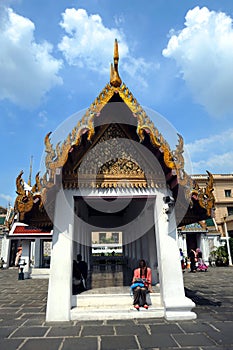 tourists at the Emerald Buddha temple or `Wat Pra Kaew`