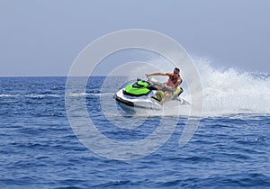 Tourists enjoy driving jetski