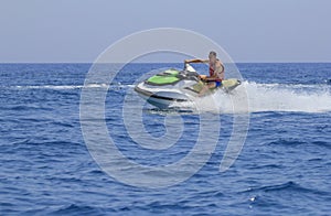 Tourists enjoy driving jetski