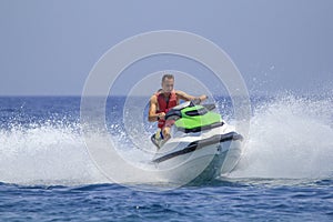 Tourists enjoy driving jetski