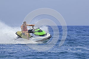 Tourists enjoy driving jetski