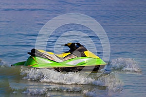 Tourists enjoy driving jetski on the ocean, Space for text. Hot summer time