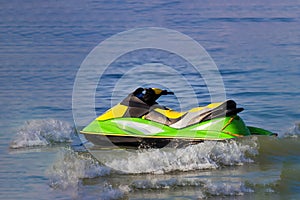 Tourists enjoy driving jetski on the ocean, Space for text. Hot summer time